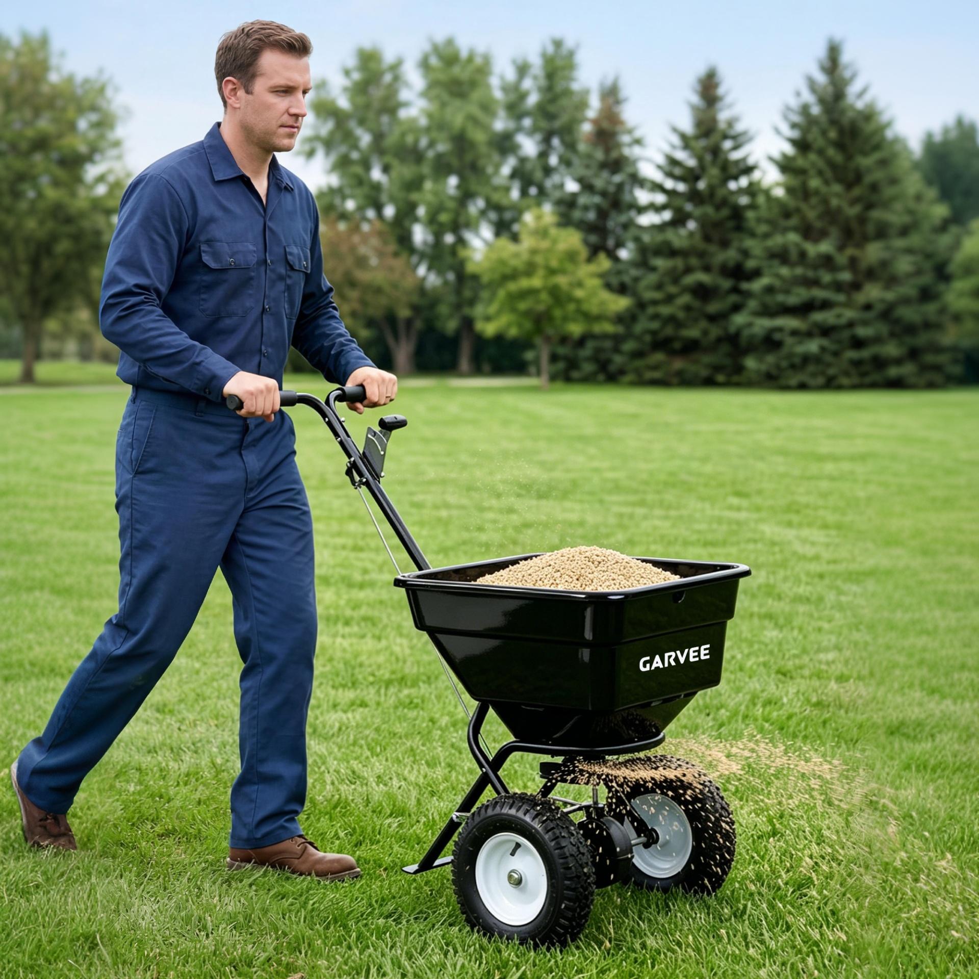 Garvee 100 lb Push Broadcast Spreader, T-Handle Walk-Behind Lawn & Garden Fertilizer Spreader with 58 L Hopper, 0–12 ft Coverage, 13" All-Terrain Wheels & 20-Level Flow Control for Seed, Fertilizer, Salt & Ice Melt, Green/Black
