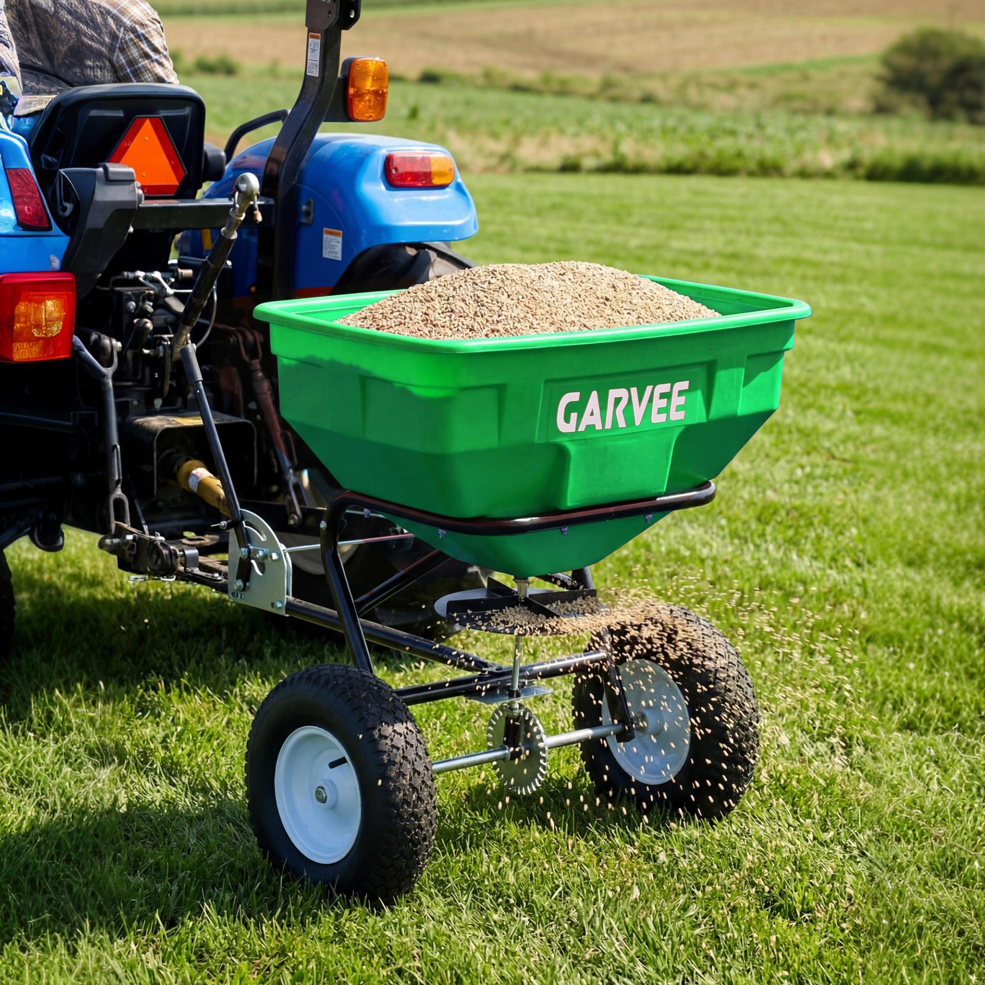 Garvee 130 lb Tow-Behind Broadcast Spreader, Heavy-Duty Lawn & Garden Spreader with 0–12 ft Coverage, Universal Hitch, 13" Pneumatic Tires & 20-Level Flow Control for ATV, UTV & Riding Mower, Green